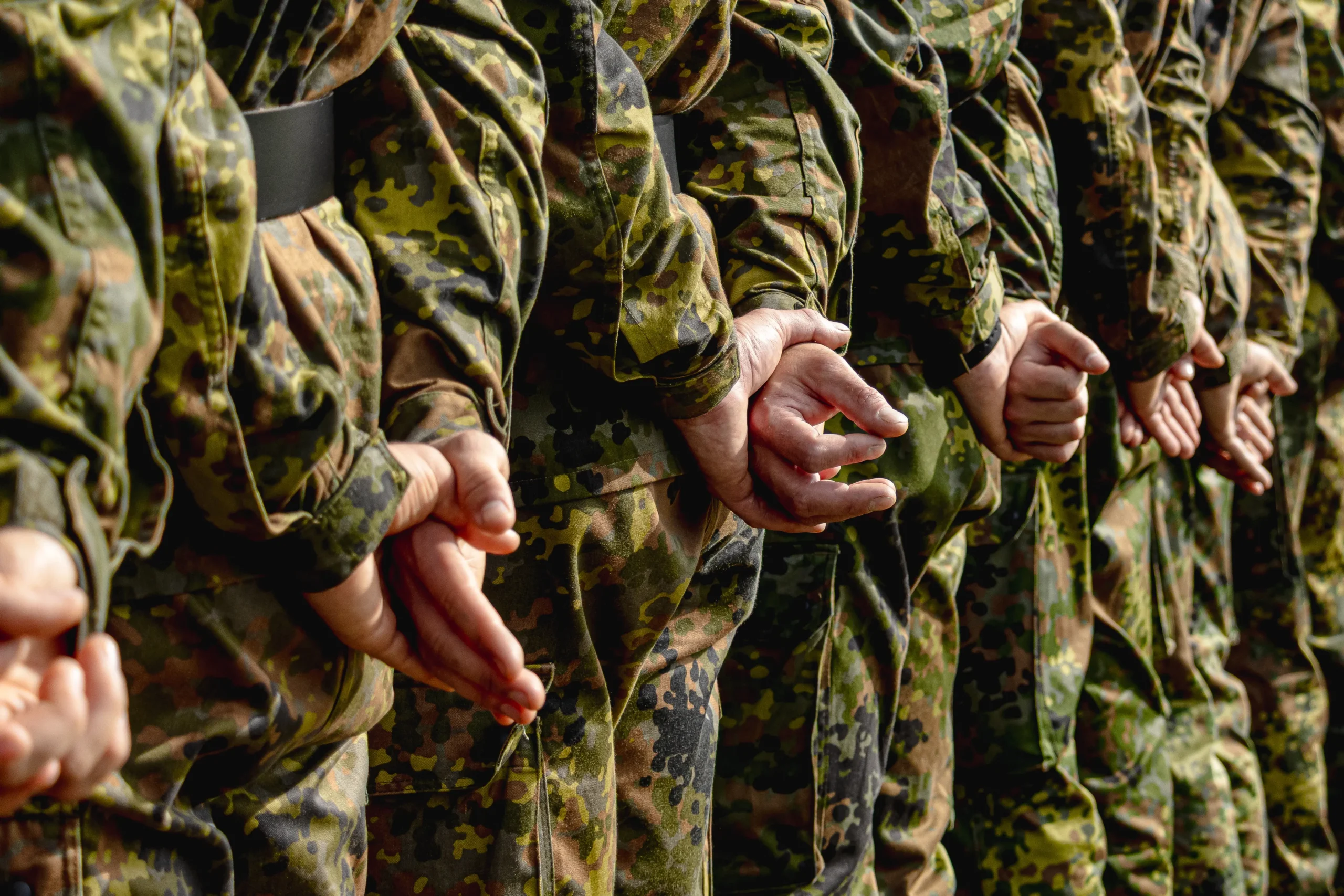Group Of Soldiers In Camo Patroling Lineup scaled